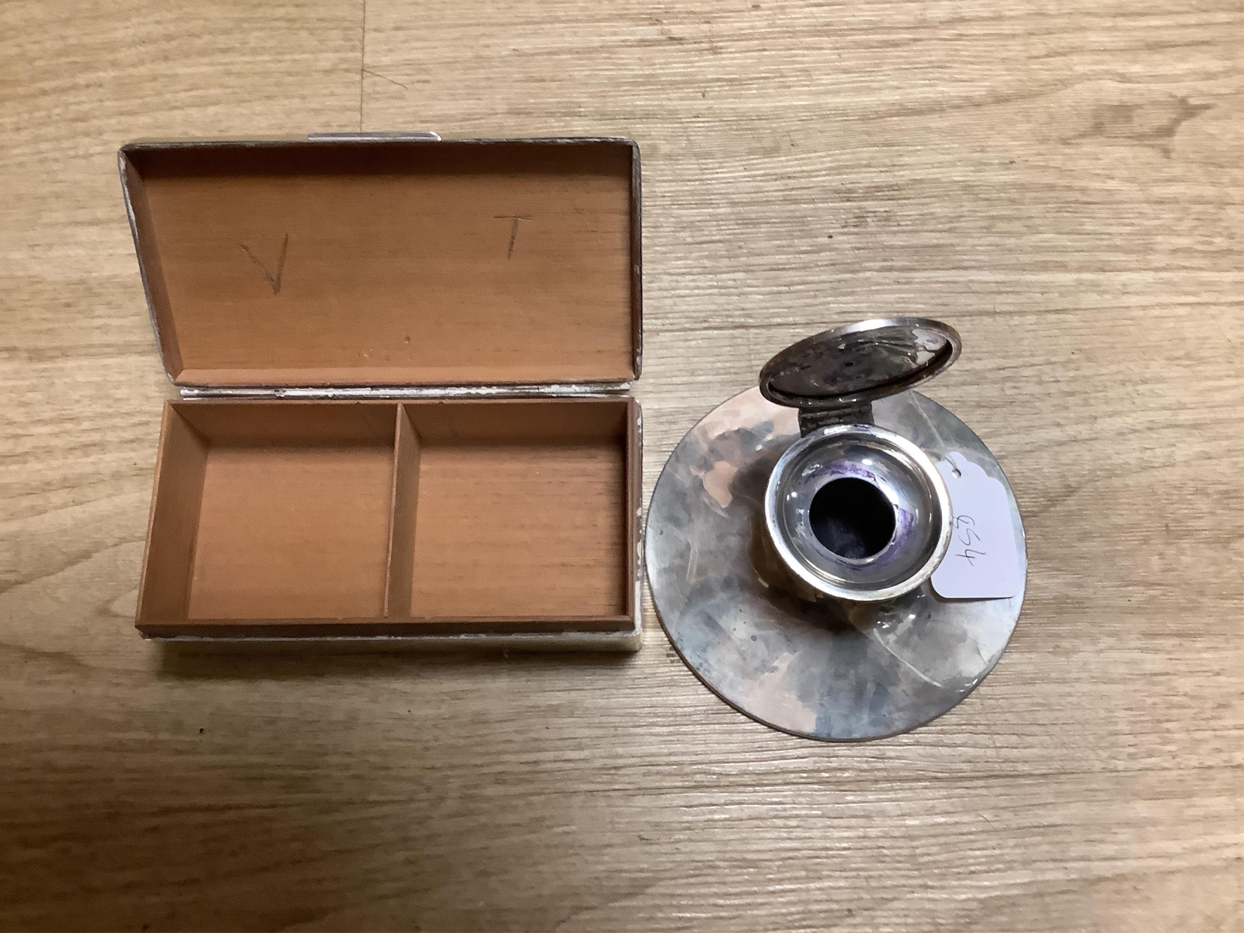 A silver mounted capstan inkwell, Birmingham, 1914, a silver mounted cigarette box and a cased pair of silver menu holders. Condition - poor to fair